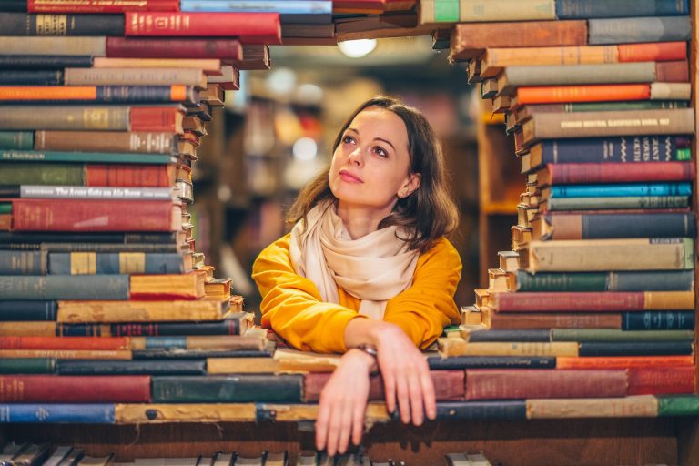 Attractive young girl in a bookstore